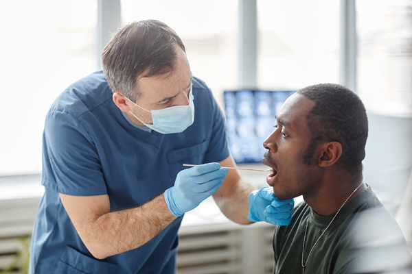 Woman having a saliva test done